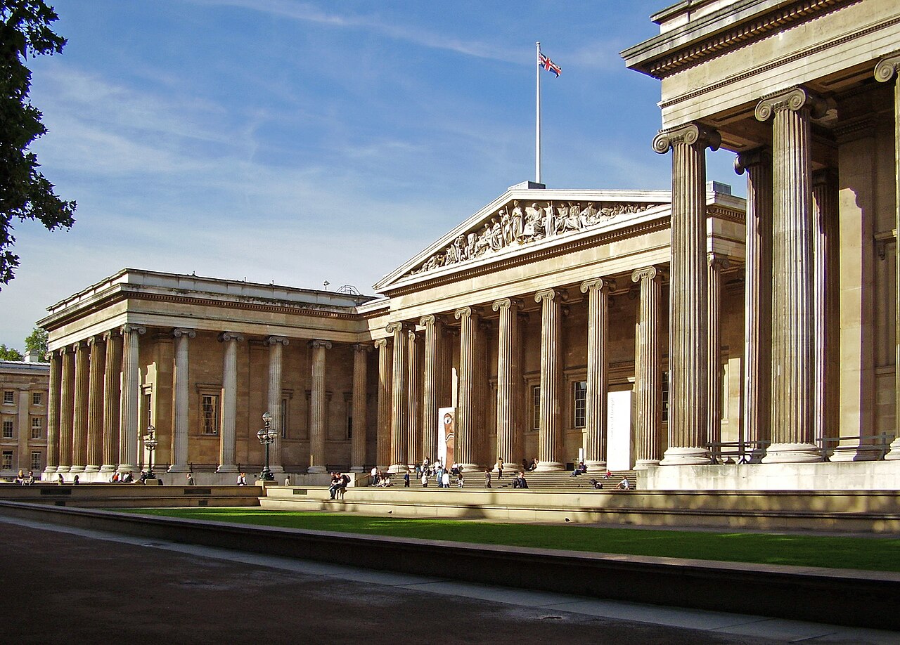 The British Museum facade, London, with Union Jack flag